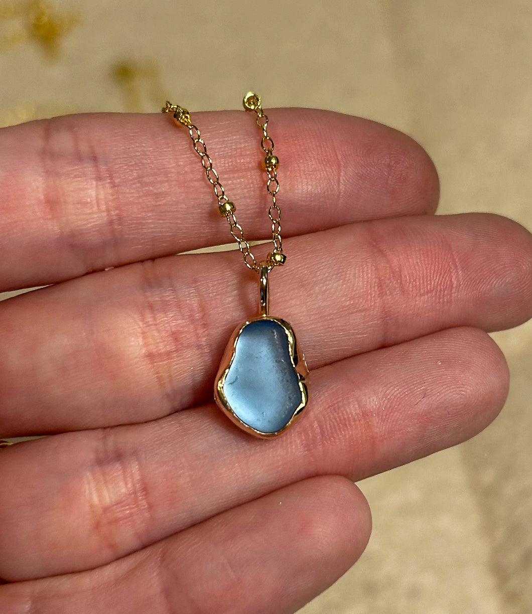 gold sea glass necklace -cornflower